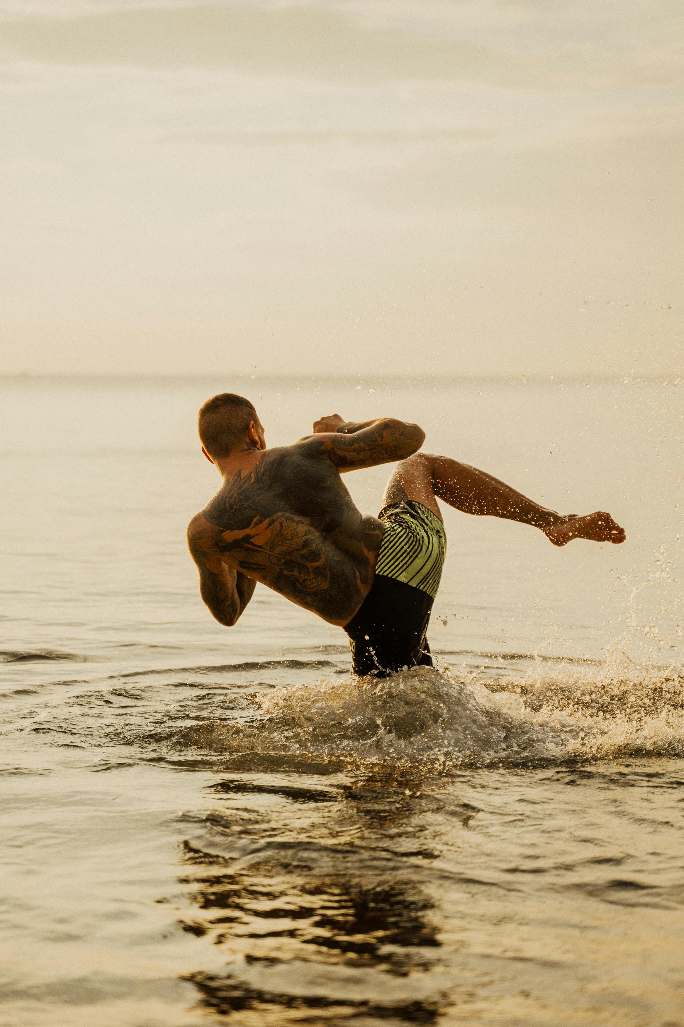 A man kicking out of water